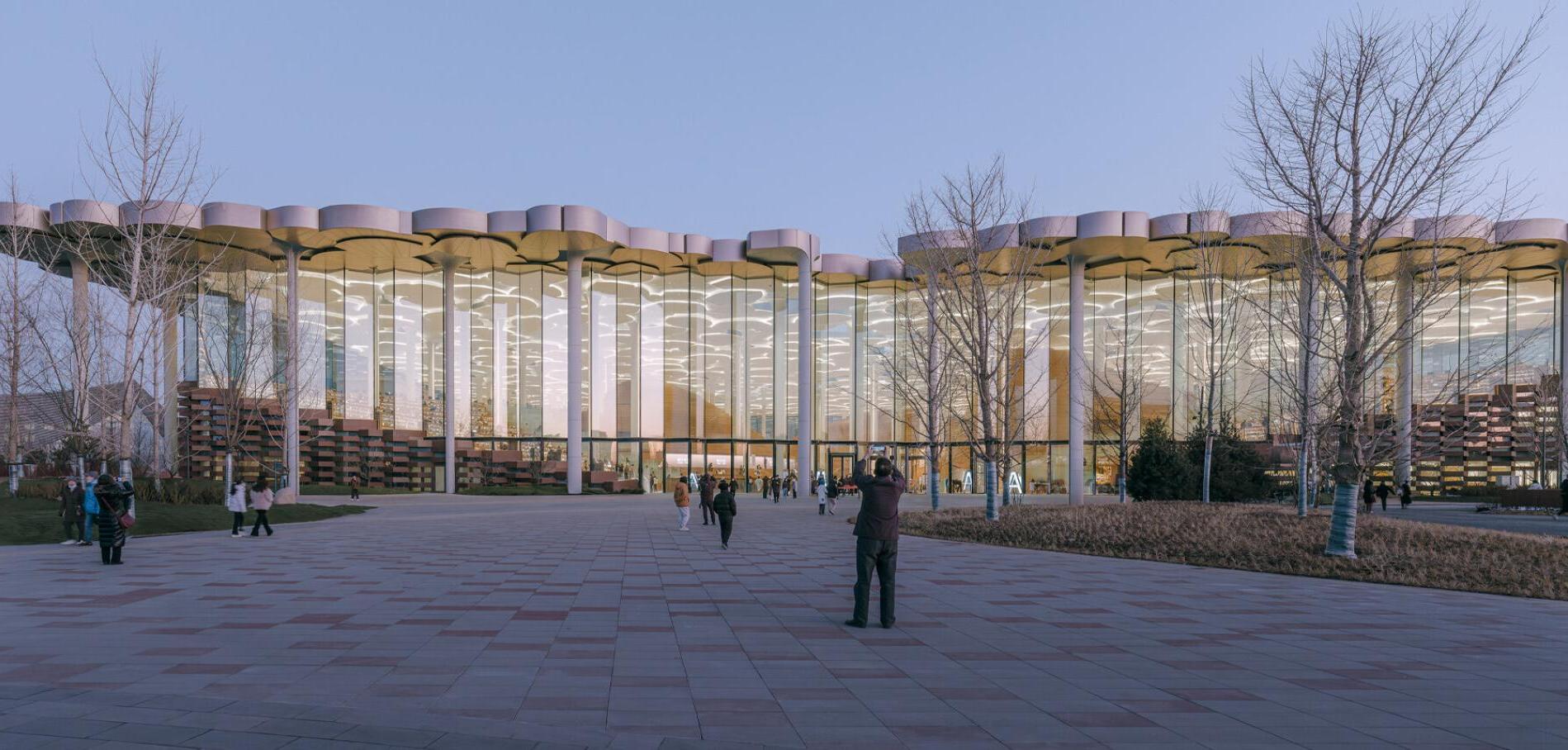 A close-up image of LOPO’s terracotta panels in brick-red and sandy beige, highlighting the texture, color, and precision craftsmanship used in the Beijing City Library’s facade design.