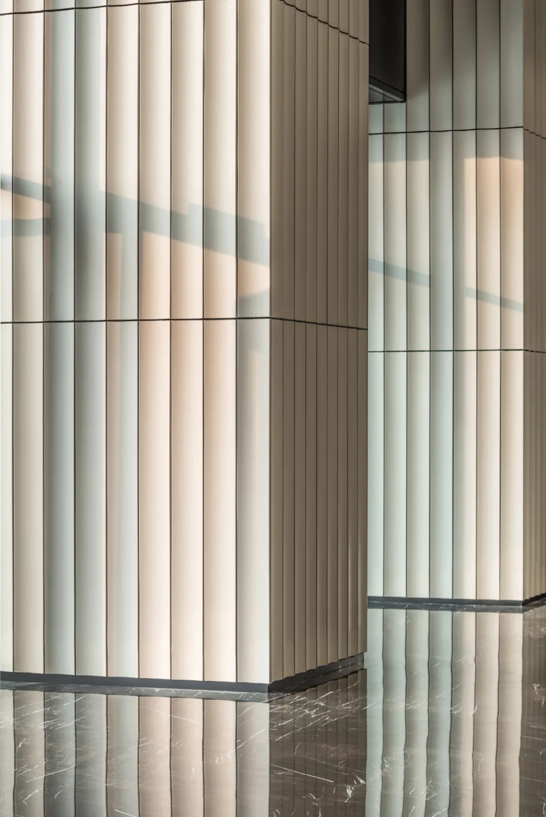 Close-up view of terracotta panel on a lobby column