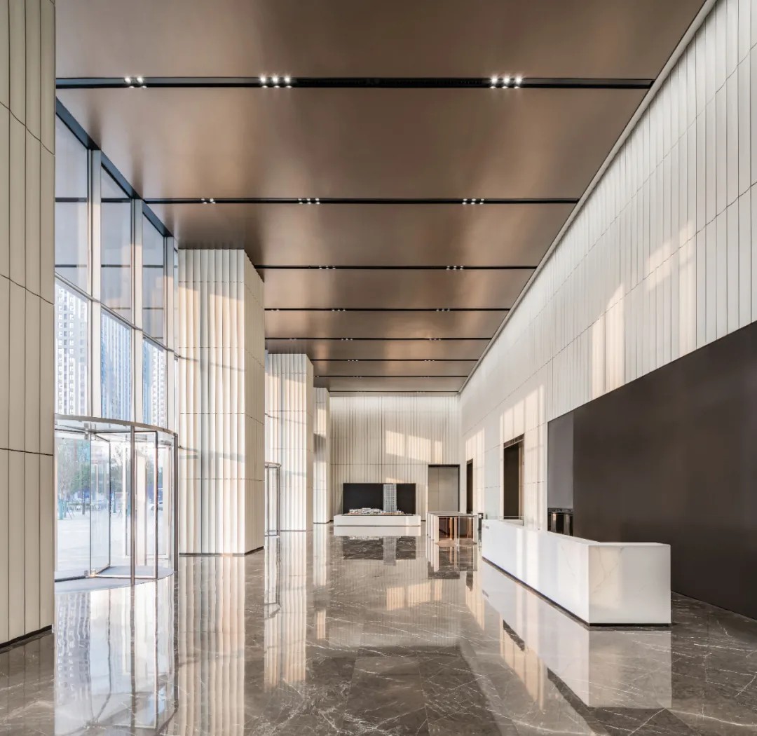 Depth view of Vanke Metropolis lobby with terracotta panels