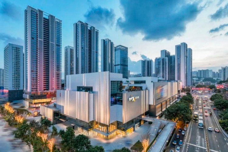 Guiyang MixC exterior view at night with terracotta facade illuminated